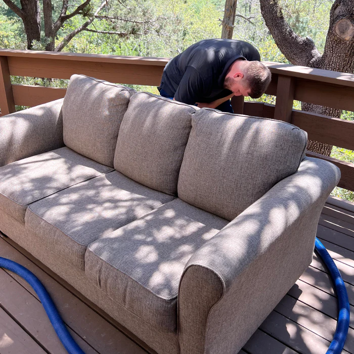man cleaning a couch phoenix az